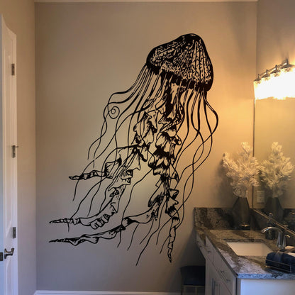 Black jellyfish decal on a white wall in a bathroom. 