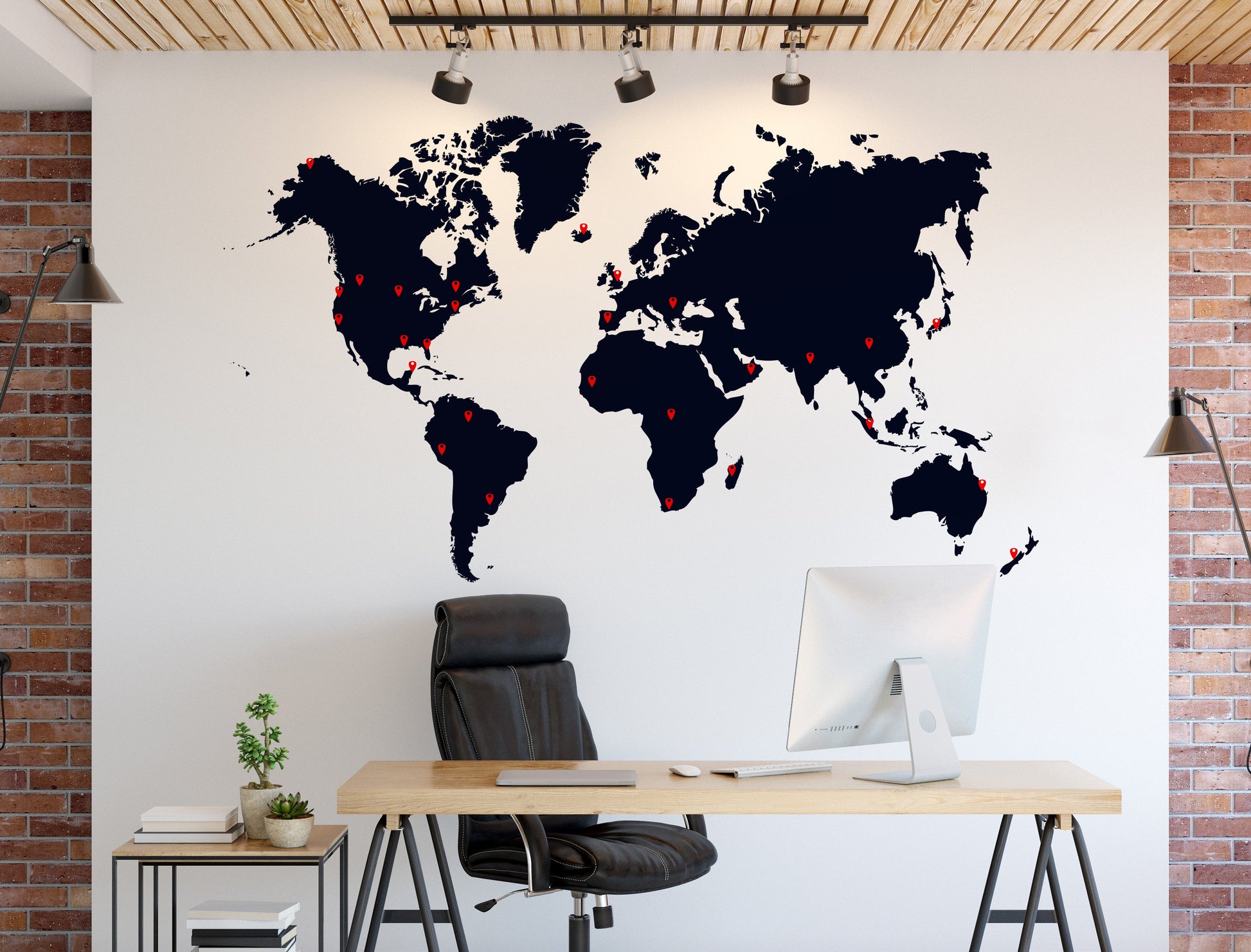 Black world map wall decal on office wall, stylish and informative decor.