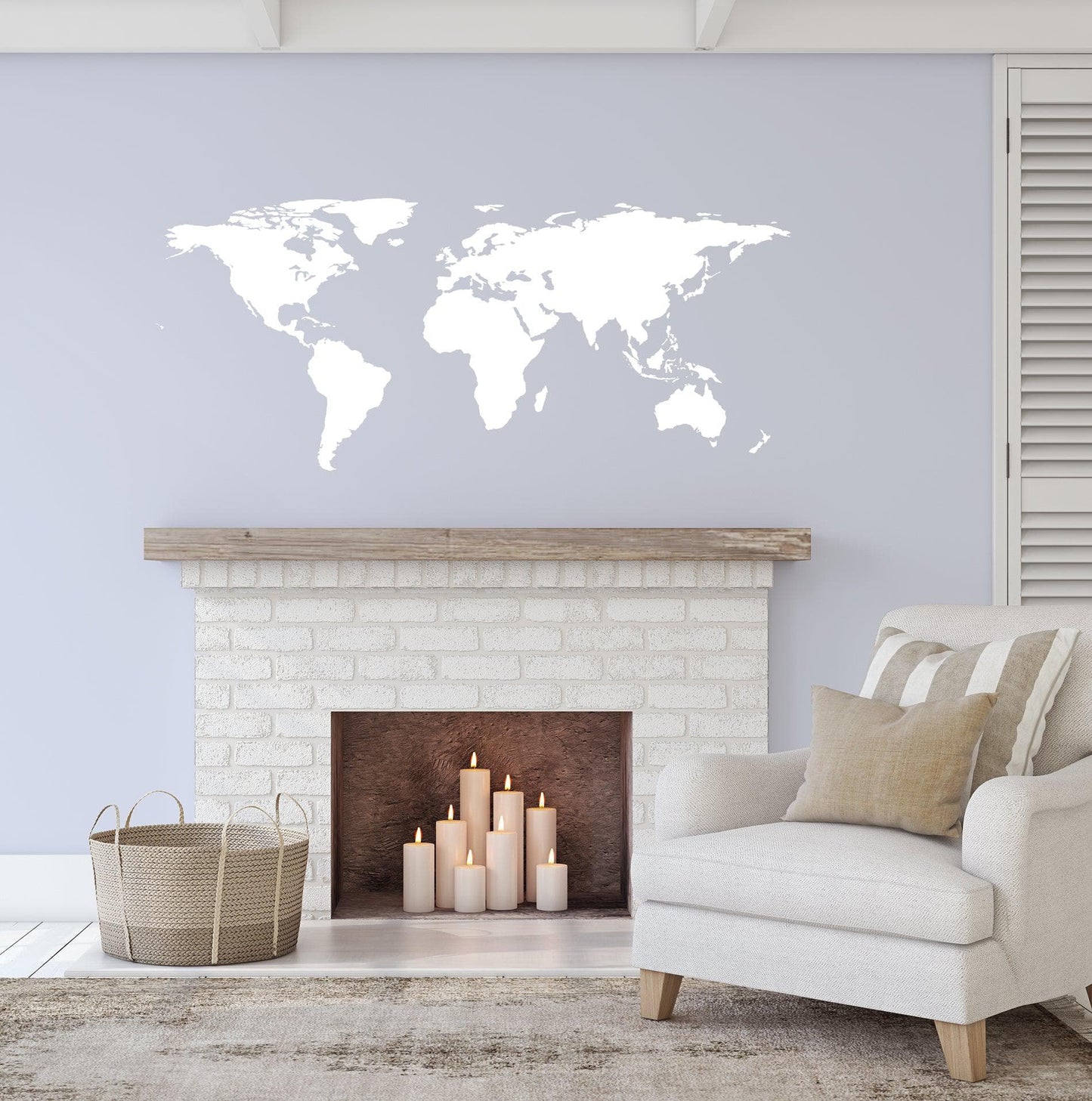 White world map decal on a gray wall in  a living room.