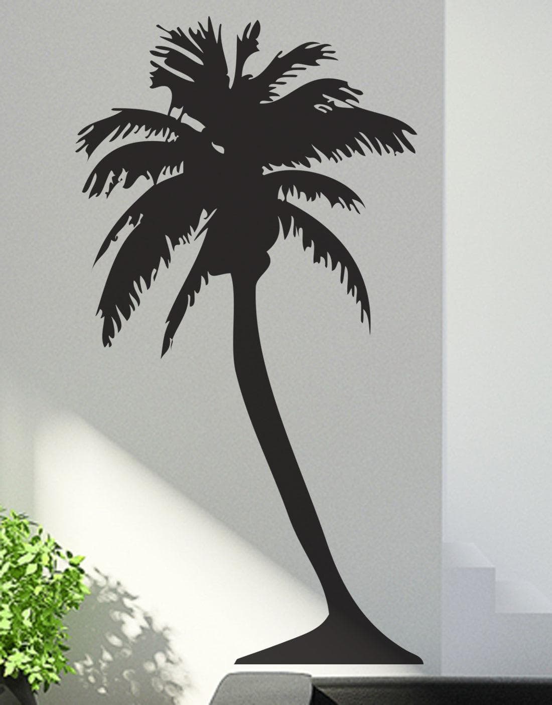 Black palm tree decals on a white wall.