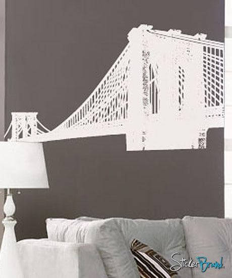 Brooklyn Bridge New York NYC Vinyl Wall Decal Sticker in white on a gray wall over a couch.
