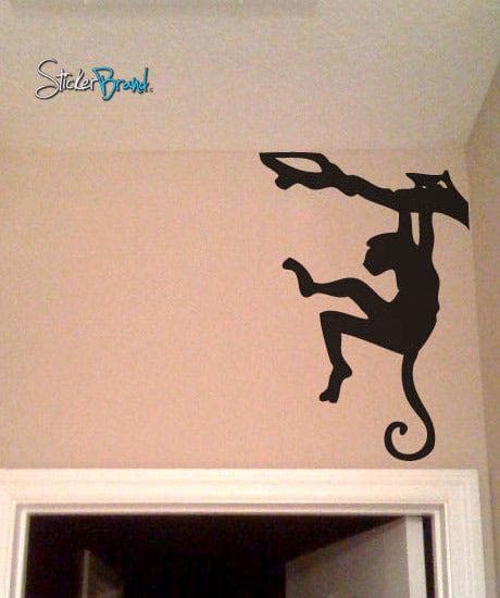Monkey Hanging on Tree Branch. Safari Theme Decor over a door frame.