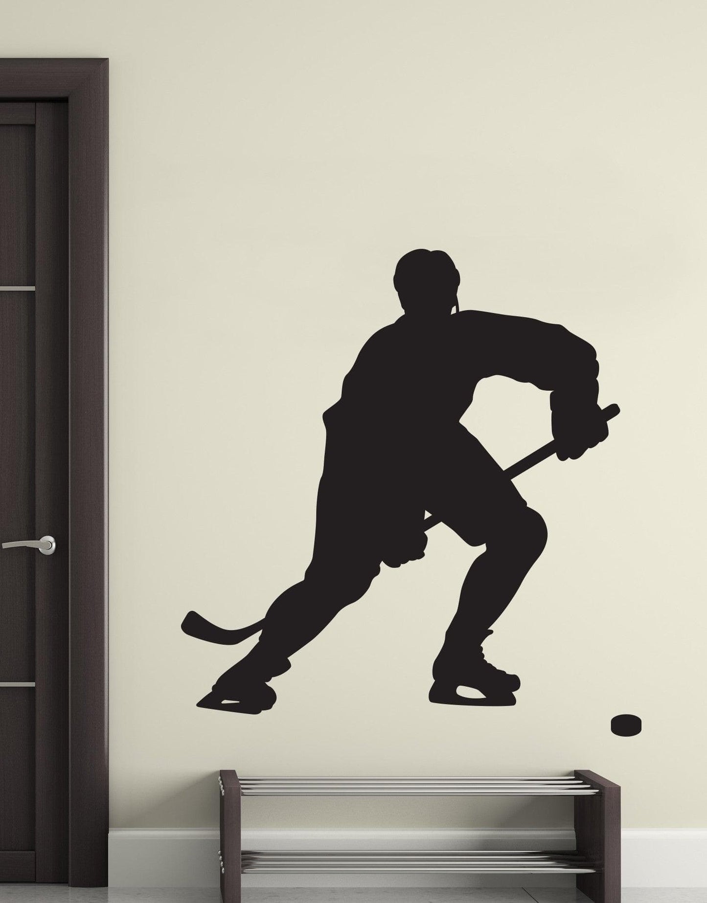 Hockey Player Vinyl Wall Decal Sticker on a white wall over a shoe rack