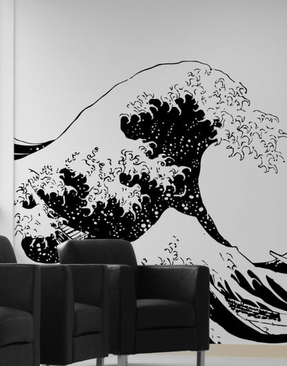 The Great Wave wall decal on a white wall in a living room.