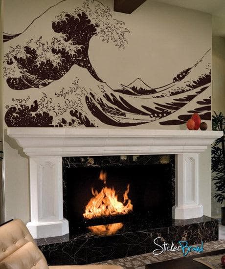 The Great Wave wall decal on a white wall above a fireplace.