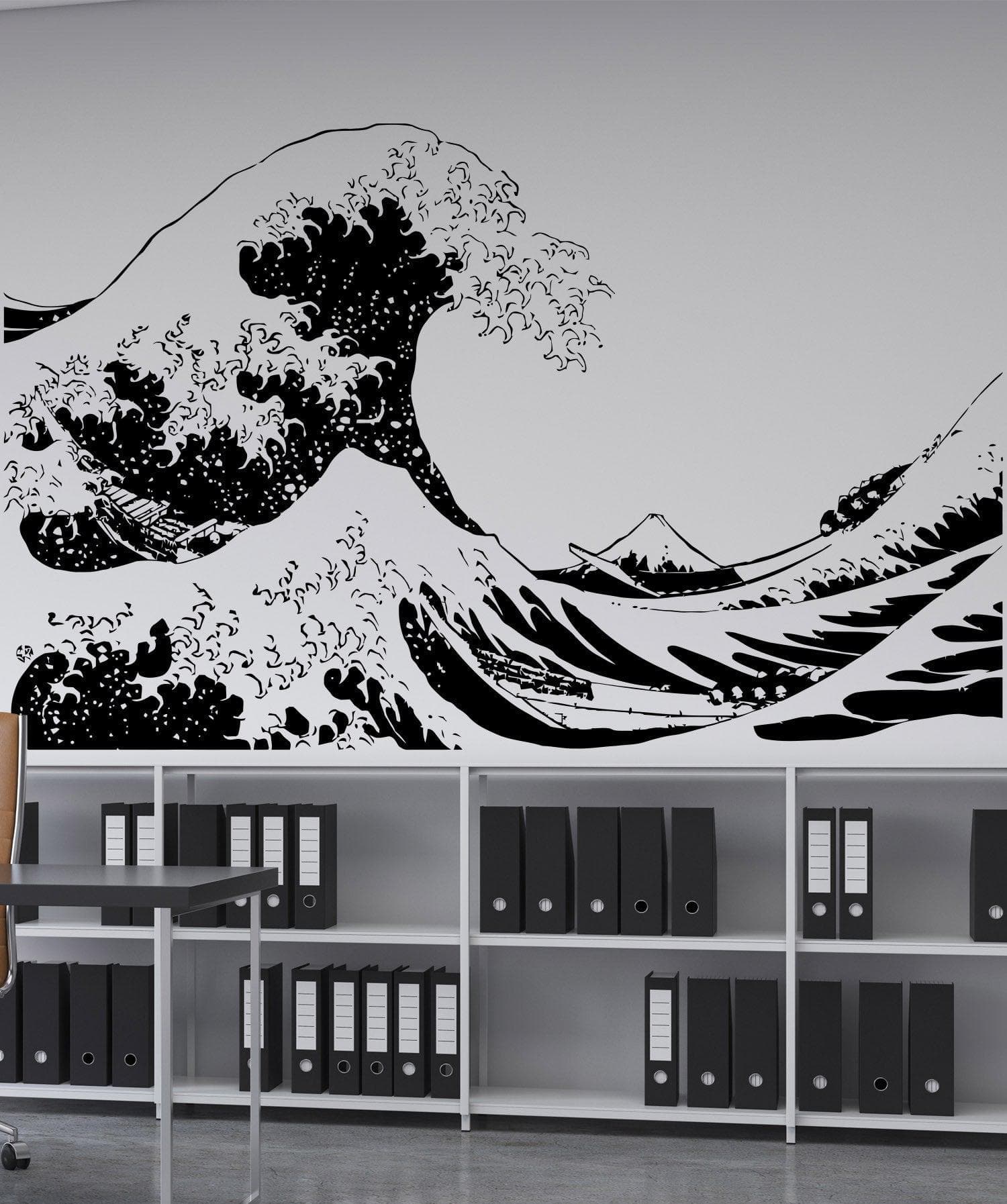 The Great Wave wall decal on a white wall above a shelf with binders.