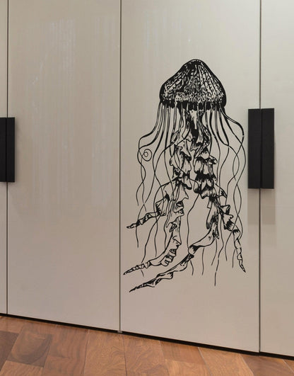 Black jellyfish wall decals on a white cabinet door.
