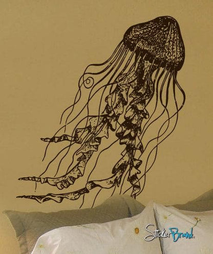 Black jellyfish decal on a light brown wall in a bedroom.