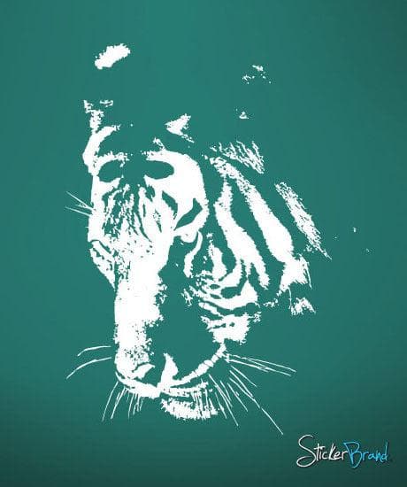 A white decal of a tiger's face on a turquoise background.