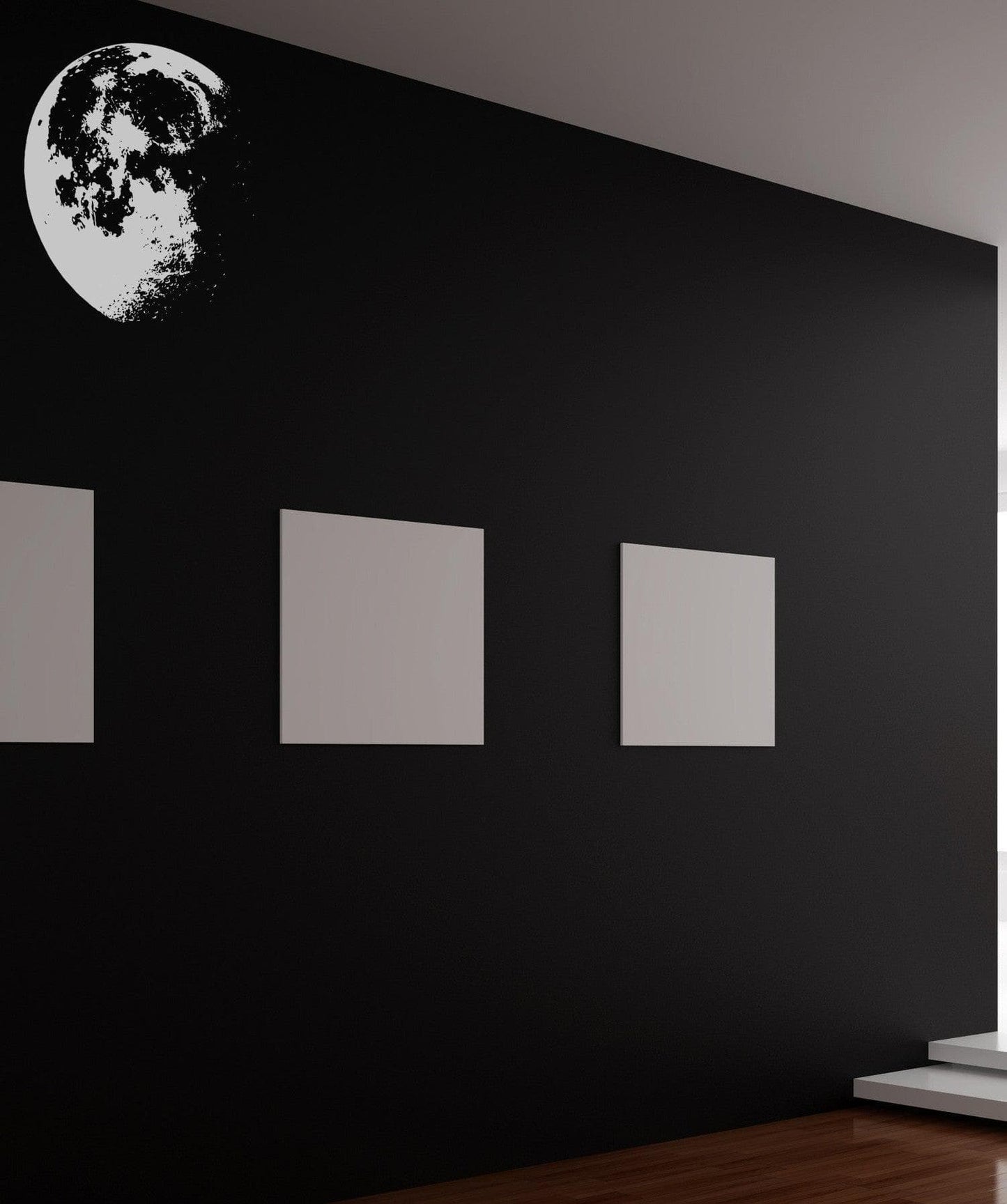 White moon decal on a black wall. 