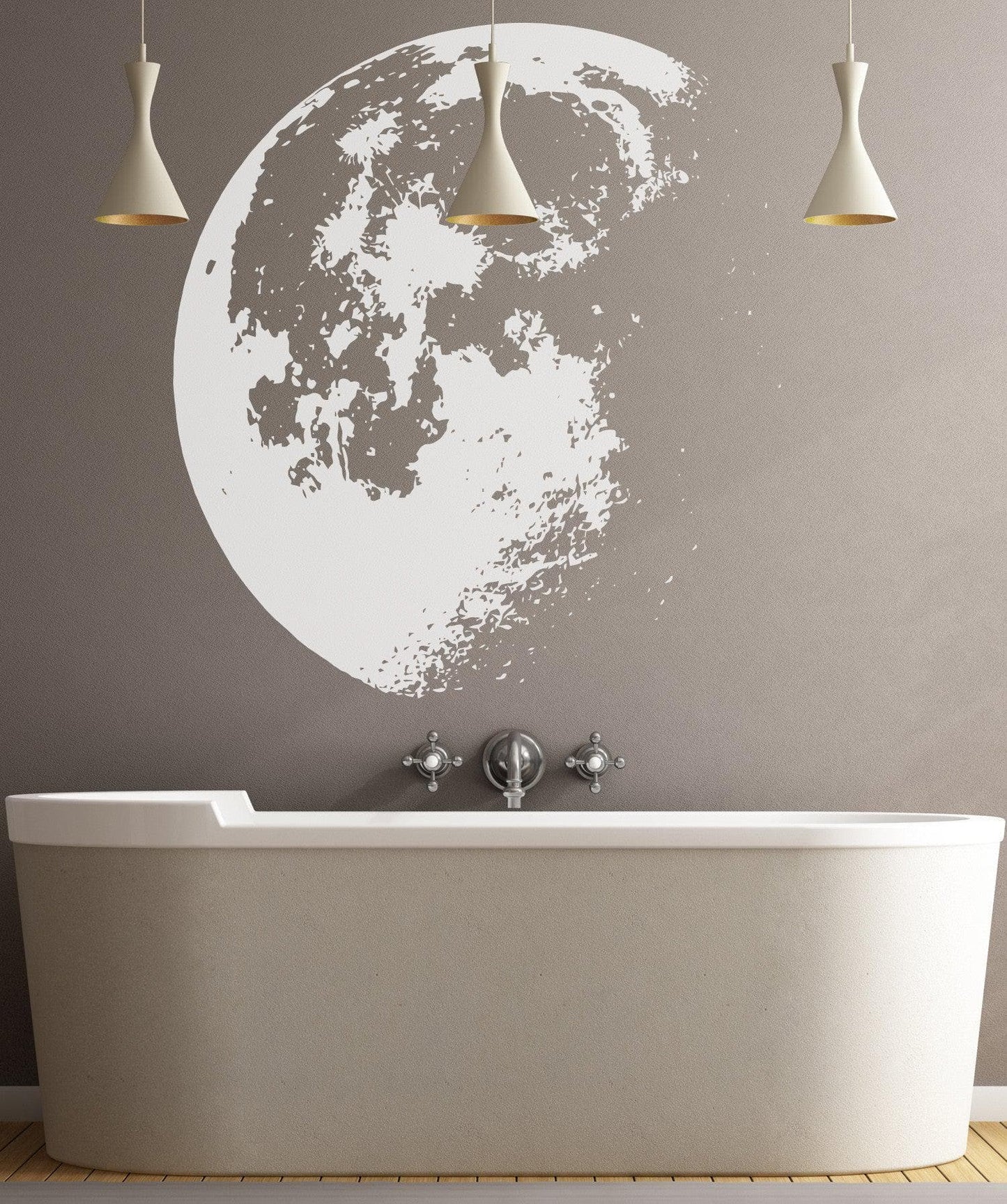 WhiWhite moon decal on a grey wall in a bathroom. 
