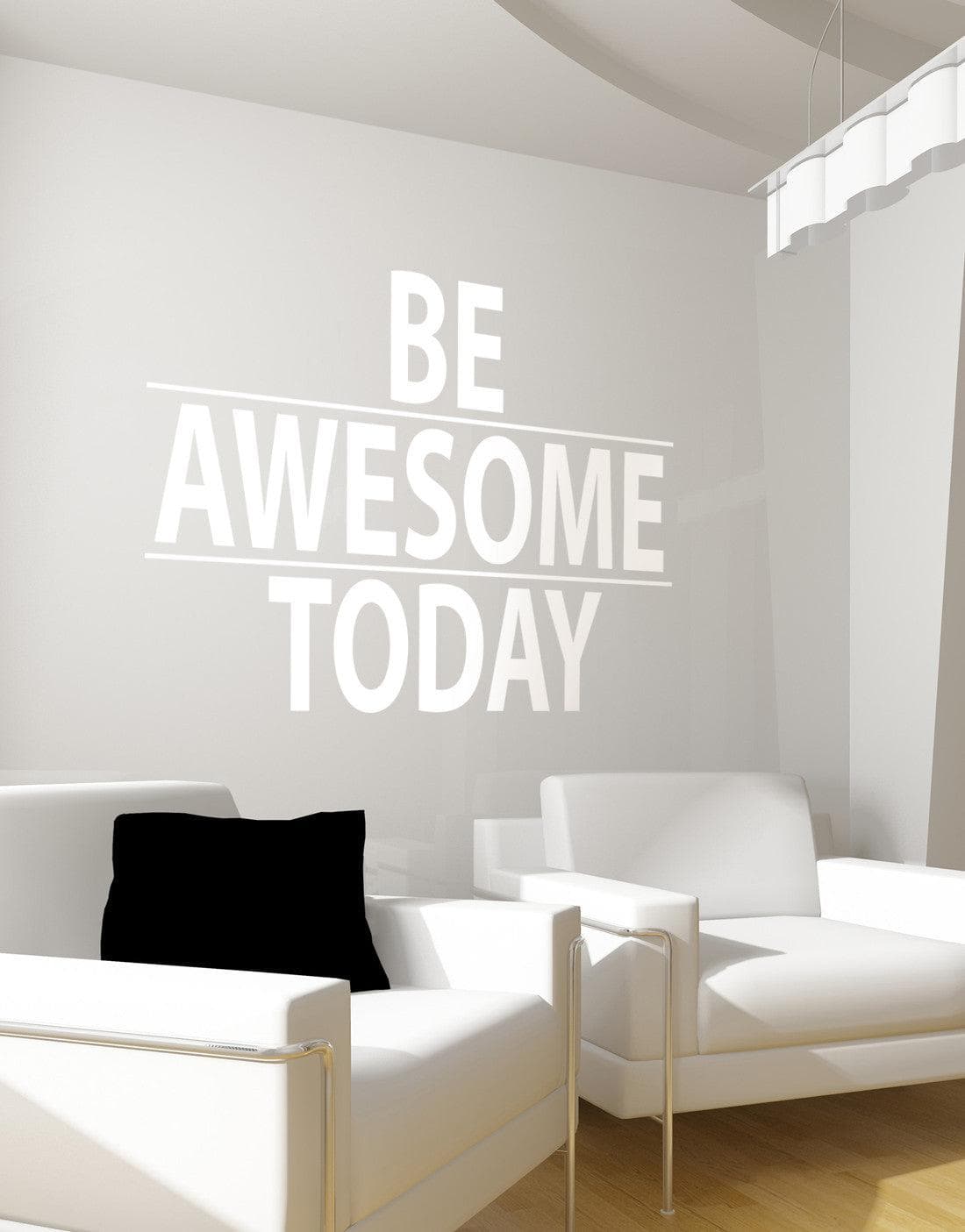 A white text decal saying "BE AWESOME TODAY" on a gray wall above two white chairs.