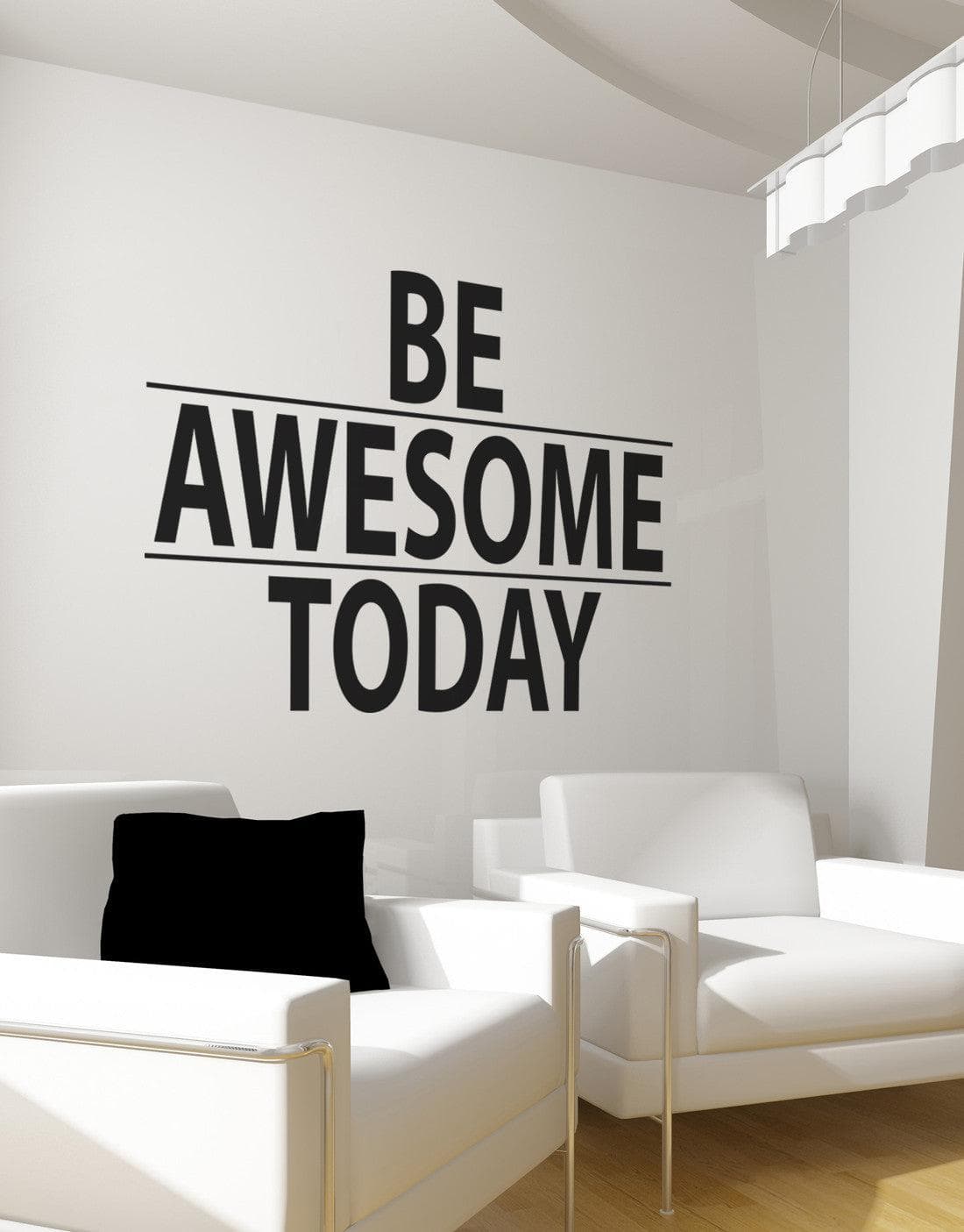 A black text decal saying "BE AWESOME TODAY" on a gray wall above two white chairs.