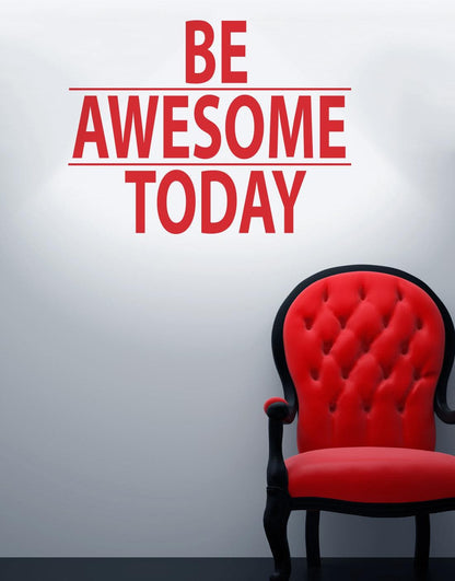 A red text decal saying "BE AWESOME TODAY" on a white wall over a red chair. 