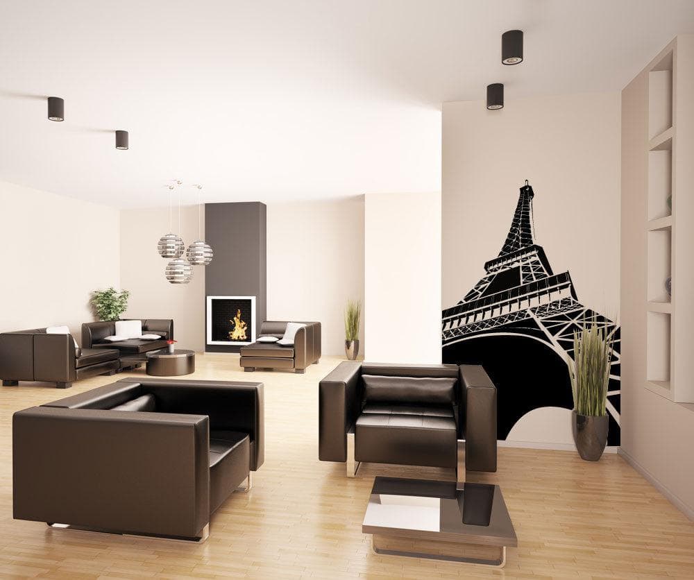 A black decal of the Eiffel Tower on a white wall in a living room.