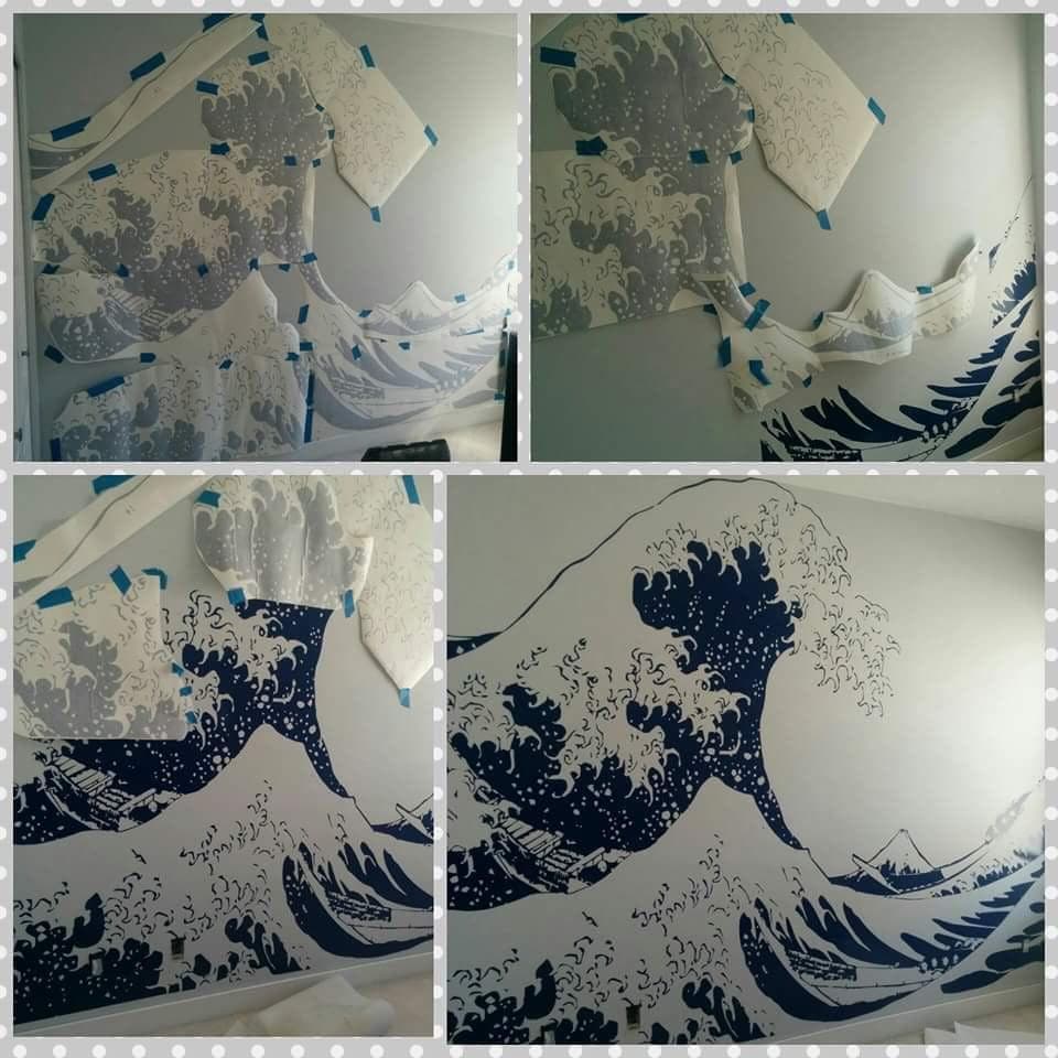 4 images showing a blue great wave wall decal being assembled on a white wall.