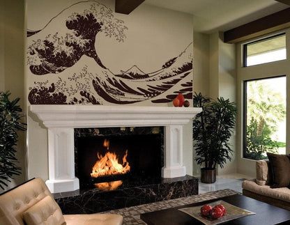 The Great Wave wall decal on a white wall above in a fireplace in a living room.