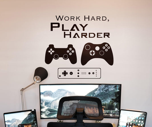 Work Hard, Play Harder wall decal featuring gaming controllers above a desk setup.