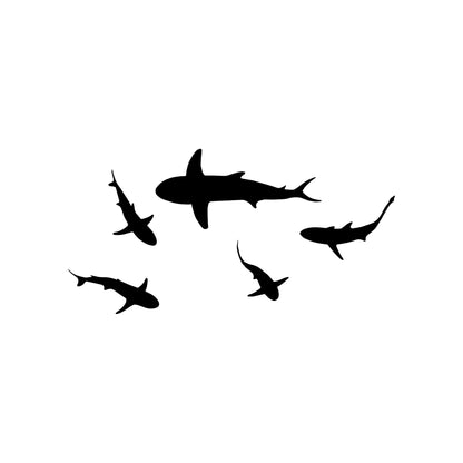 A black decal of a school of sharks on a white background.