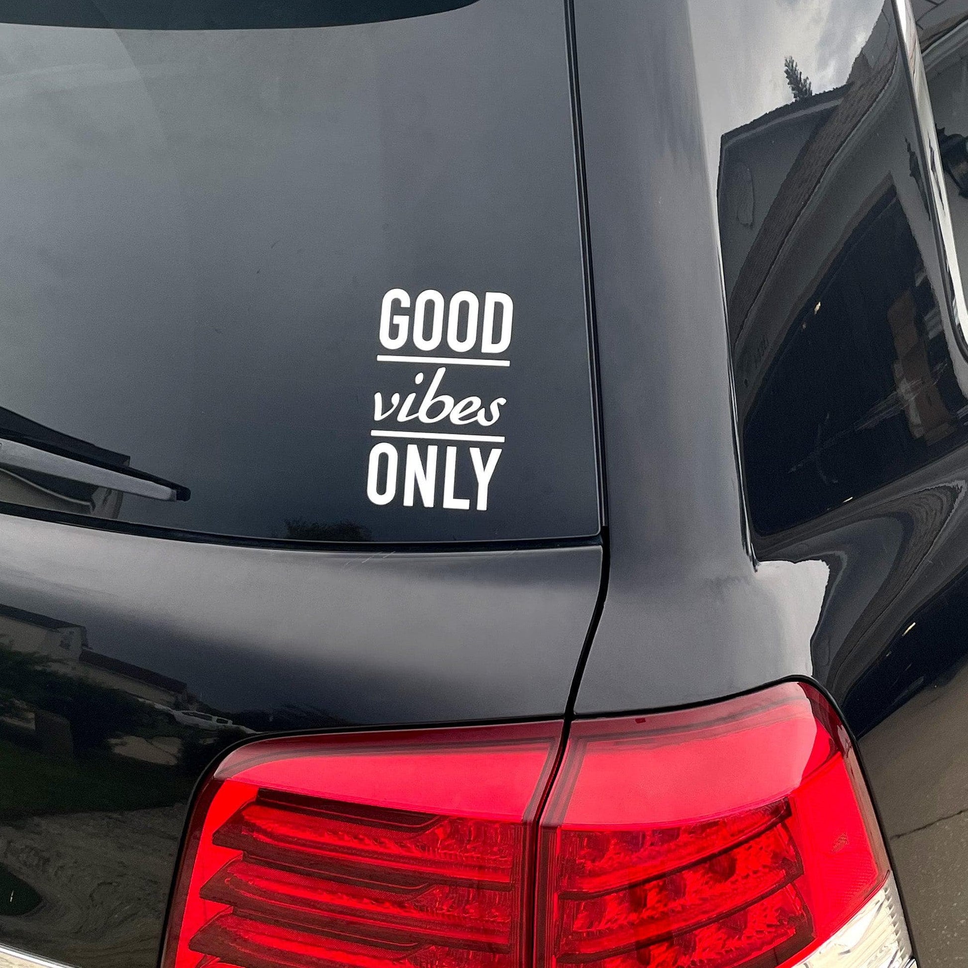 Good Vibes Only Motivational Vinyl Wall Decal on a car window.