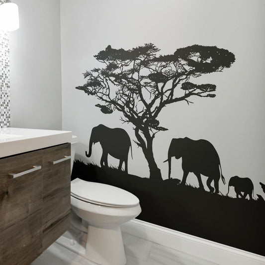 African Safari Theme Wall Decal Sticker. Elephant Family Migration on a bathroom wall next to a toilet and sink.