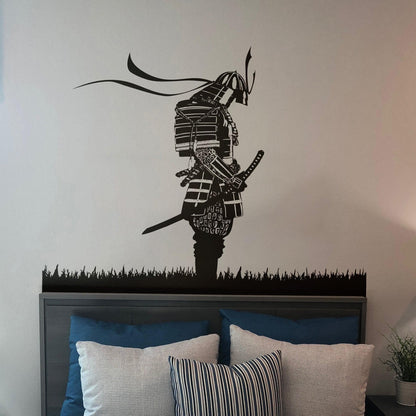 A black decal of a samurai on a white wall in a bedroom. 