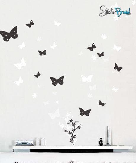Butterfly Flower Floral Vinyl Wall Art Decal Sticker on a white wall over a table.