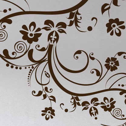 Gold swirling floral decals on a white wall.