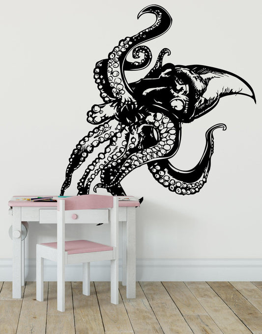 A black decal of a giant octopus on a white wall above a pink and white desk and chair.