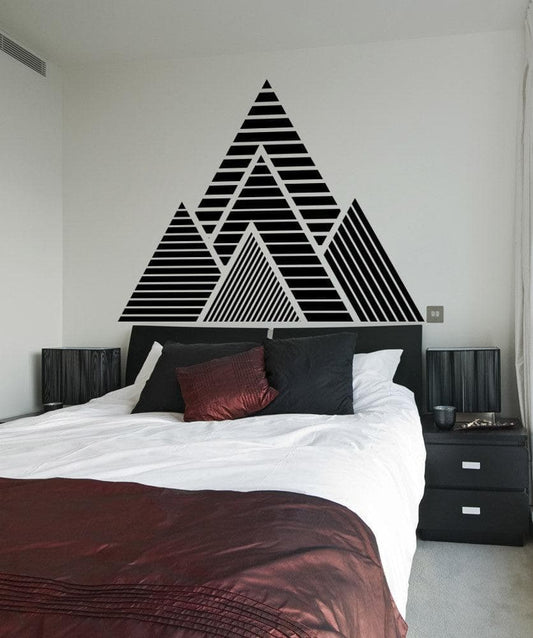 Geometric Mountain Wall Decal Sticker. Geometric Mountains Vinyl Wall Decal Sticker over a bed.